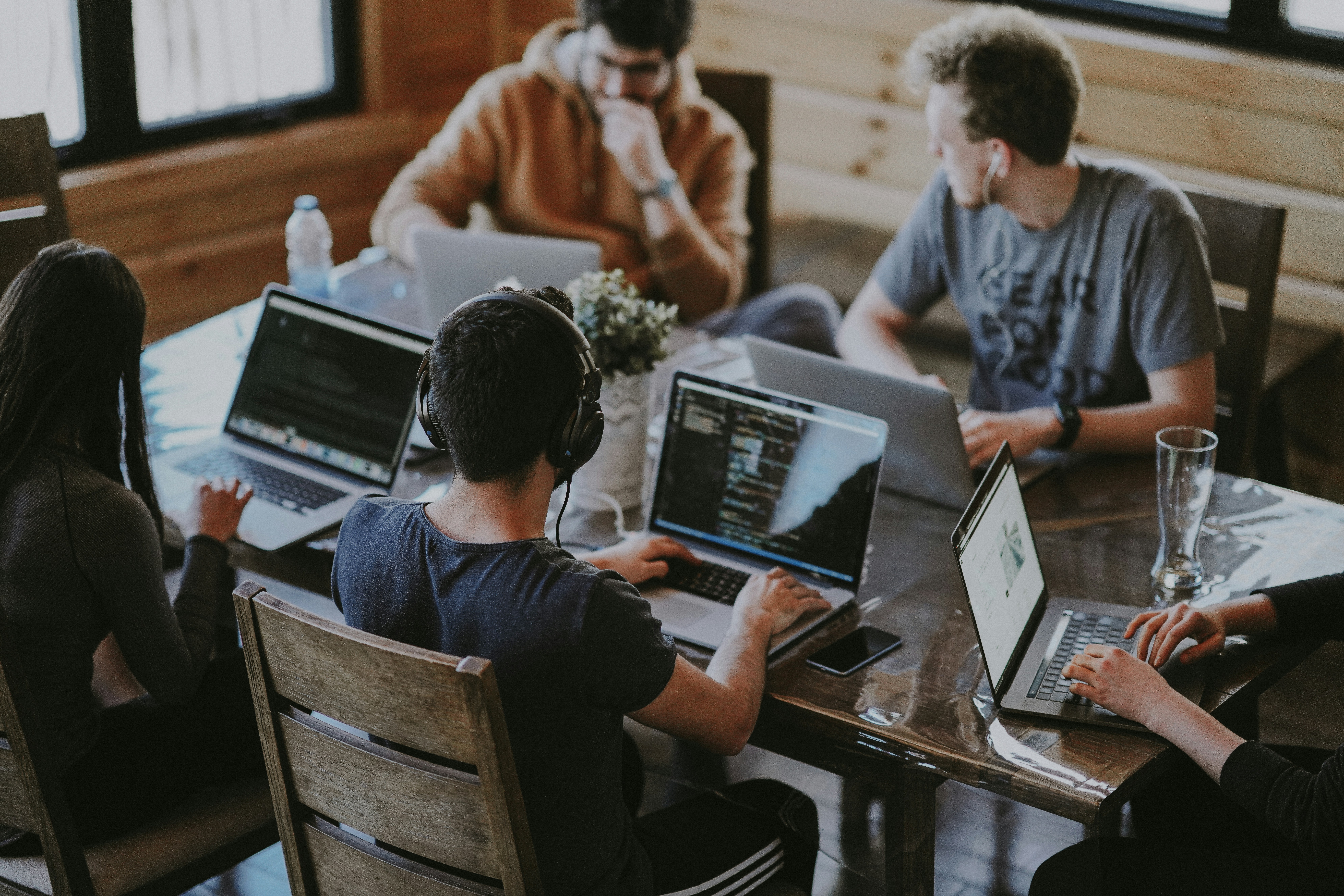 People sitting around a table collaborating on a project.